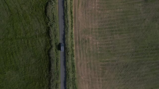 Aerial video of a vehicle traveling in the Doolin Tower area, Ireland