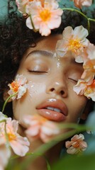 Obraz premium A serene model relaxes with her eyes closed, her face gracefully covered in soft flowers and shimmering skincare. The composition celebrates natural beauty and artistry