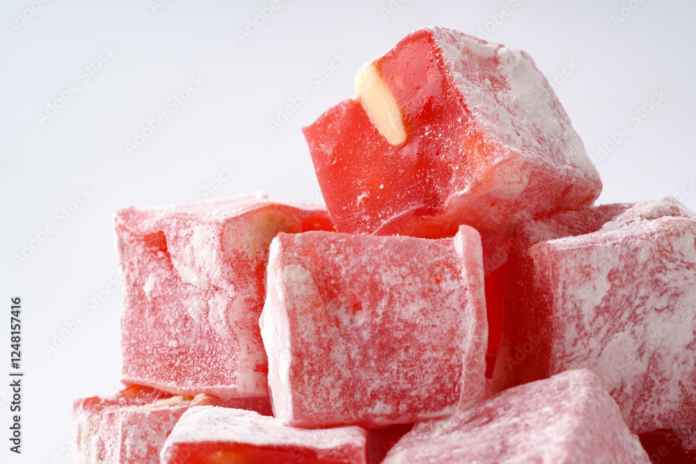 Poster delightful red confection stacked attractively with a touch of powdered sugar for a tempting present