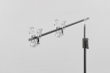 metal tripod with clips for hanging backgrounds or objects when photographing, stand