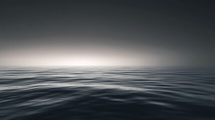 Obraz premium Serene Calm Ocean Surface Under Soft Grey Sky at Dusk
