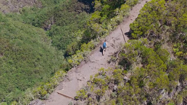 France - Reunion Island - Mafate - Scout Path, following woman walking on 2 fesses Area