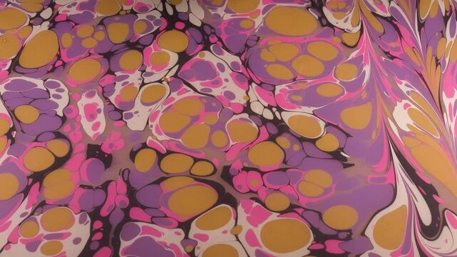 The art of marbling, which is an ornamental art. It is making patterns with paints on water condensed with tragacanth and transferring these patterns onto paper.