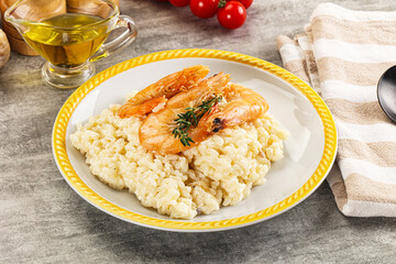 Italian risotto with prawn served thyme