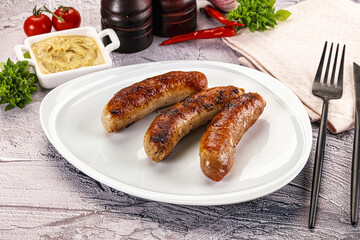 Delicous natural roasted sausages in the plate