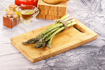 Vegan raw green asparagus heap
