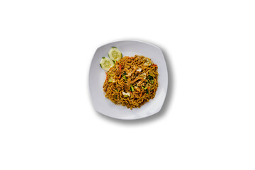 Top view of Delicious plate of traditional Indonesian fried noodles (bakmi goreng), stir-fried with vegetables, chicken, and savory seasoning. Isolated white background.