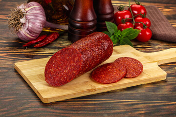Spicy pepperoni sausages with sliced piece