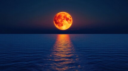 Blood moon rising over calm ocean at night; celestial event