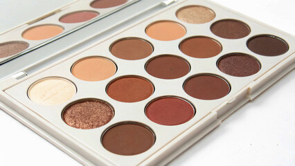 An eyeshadow palette showcasing an array of matte and shimmer shades, ideal for both everyday wear and glamorous occasions.