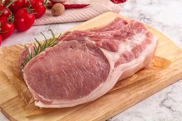 Raw potk loin steak with bone