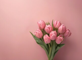 Obraz premium Closeup of vibrant pink tulip bouquet with visible stems and leaves, set against a soft pink background cheerful spring vibes.