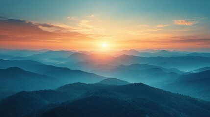 Obraz premium Majestic sunrise over misty mountain range