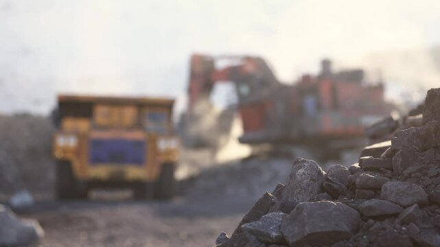 Dynamic excavation of open pit coal mine with heavy machinery operations, mining industry.