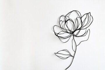 A single line drawing of a flower in black ink on a white background, emphasizing simplicity and elegance.