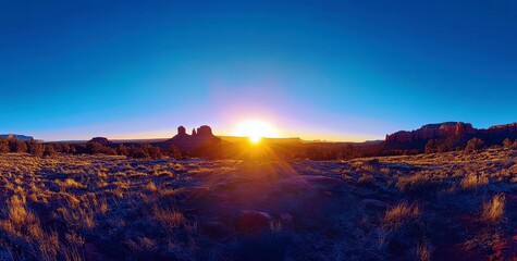 Fototapeta premium Majestic Sunset Over Rugged Landscape with Vibrant Colors and Dramatic Horizon in a Desert Setting