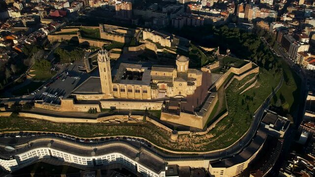 Majestic old cathedral on top of the hill and sorrounded by the city of Lleida in Catalonia, Spain. High quality 4k drone footage