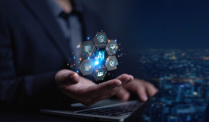 Businessman using laptop with technology AI, An virtual icon displayed in front of him screen, Ai technology, artificial Intelligence command writes code, Technology transformation digital, software