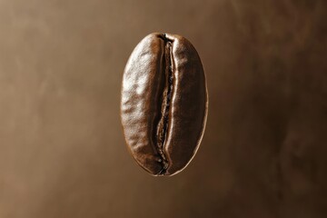 Single roasted coffee bean on a brown gradient background