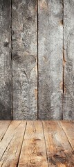 A rustic wooden background featuring weathered gray planks and a textured wooden floor, ideal for photography or design projects.