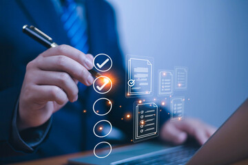 Business performance checklist concept, Businessman using laptop take an assessment,An businessman...