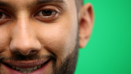 Fototapeta premium Man's face, close-up, on a green background