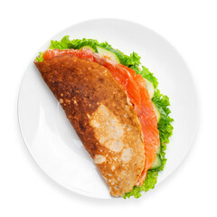 Pancake with salmon, cucumber and lettuce. Breakfast. Top view, on a white background, isolated.