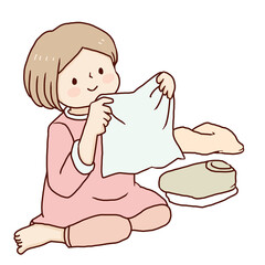 洗濯物を畳む女性