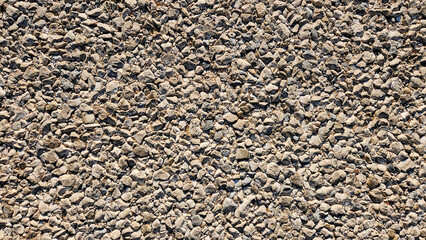 The texture of an asphalt road is characterized by its rough, gritty surface, providing good...