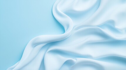 Obraz premium Soft white fabric folds on a light blue background creating a flowing and minimal aesthetic. Ideal for textures and modern designs.