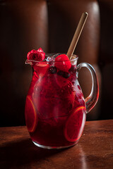 Refreshing Berry Punch Served in a Glass Pitcher With Vibrant Fruits and a Touch of Elegance in a...
