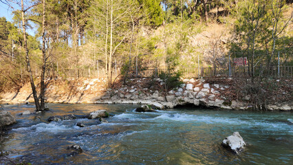 On a winter evening at Yerköprü, a scenic picnic spot in the Cakit Stream valley, located in the Taurus Mountains of Adana's Karaisali district.