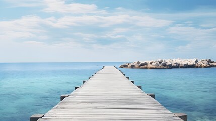 Obraz premium Rustic wooden pier or dock stretching out into calm serene ocean or lake waters with a scenic minimalist landscape and reflection of the sky