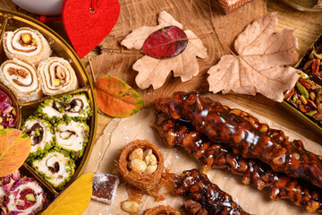 Sweet food Turkish delight on wooden background, assorted locum and candy as decorated backdrop
