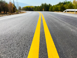 Yellow traffic line color Double solid lines to warn prohibiting overtaking, Yellow continuous tracks of prohibited overtaking painted on the asphalt, Safety driving and traffic regulating rules