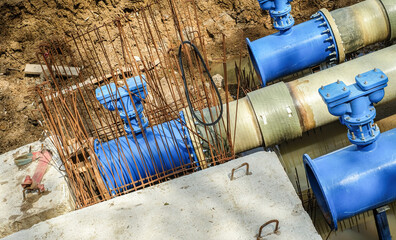New fiber glass water pipeline in trench. Replacement of old rusty tubes by new one
