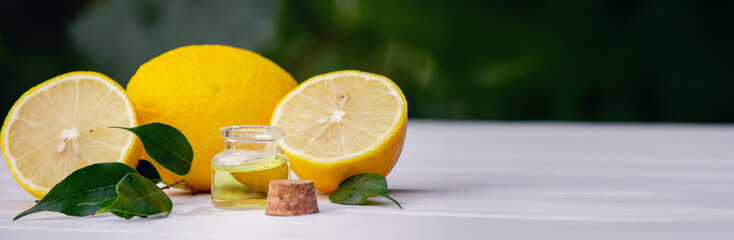 lemon oil in jars, fresh lemon. Selective focus. Nature
