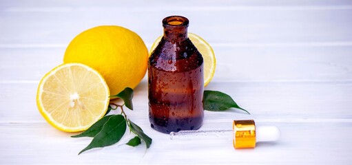 lemon oil in jars, fresh lemon. Selective focus. Nature