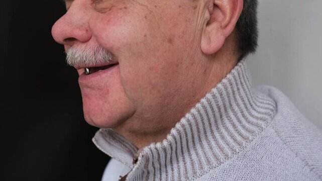A toothless smile on an elderly man. preparation for prosthetics
