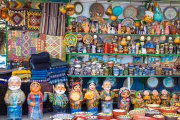 Typical ceramic colorful souvenirs selling with traditional national ethnic Uzbek patterns at...