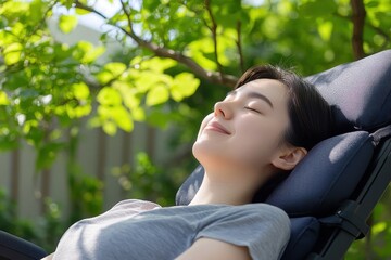 A young woman relaxes outdoors, enjoying the sunlight and greenery around her, embodying peace and tranquility.