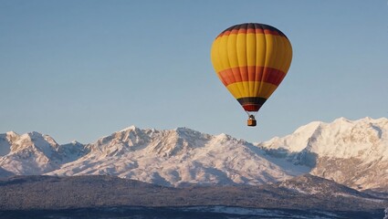Obraz premium Colorful Hot Air Balloon Over Snowy Mountains