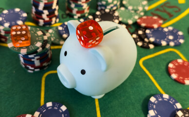 Fototapeta premium stack of poker chips and piggy bank