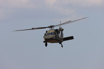military helicopter in flight