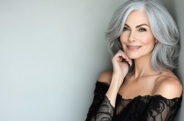 Beautiful older woman embracing aging with a genuine smile and healthy skin.