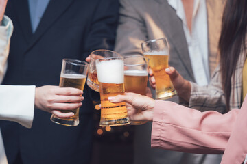 Cheers to Success: A group of colleagues raises their glasses in a celebratory toast, signifying a successful team effort and shared accomplishment. The image conveys a sense of unity, camaraderie.