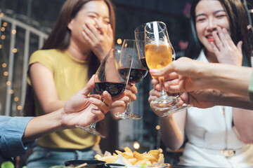 Cheers to Friendship: A close-up shot of friends raising their glasses in a toast, their laughter and smiles creating a heartwarming atmosphere of connection and joy.  