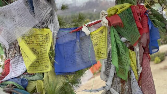 Prayer flags perched on top of a hillside in Manang