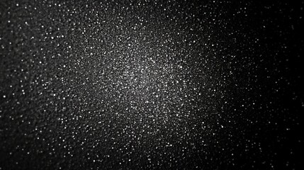 Obraz premium Distressed grainy white fine dust particles speckled gradient texture on a black background