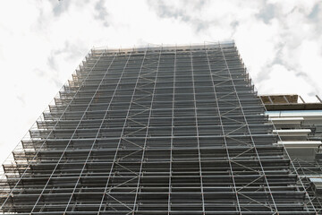 Metal Scaffolding on Building Facade, building materials assembly, structural design infrastructure